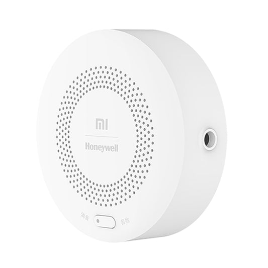 Round smart gas alarm sensor with perforated speaker grille and side outlet port
