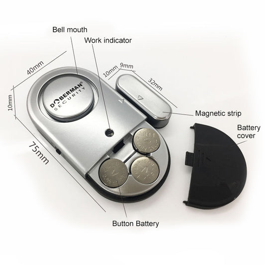 Door alarm sensor with magnetic strip, battery cover, and button battery
