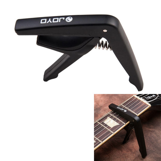 Black guitar and ukulele capo with spring clamp, plastic and steel handle