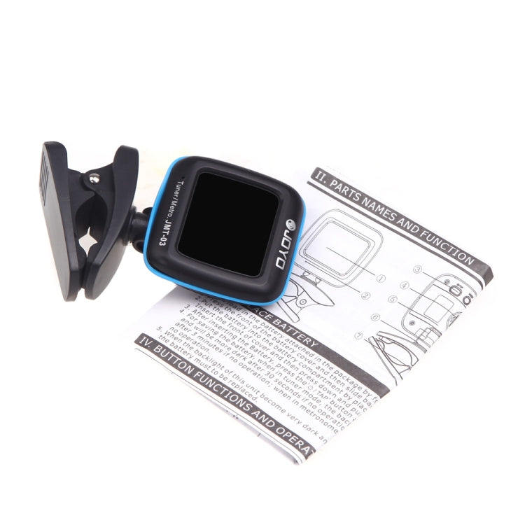 Clip-on guitar tuner metronome clipped to guitar headstock, black and blue