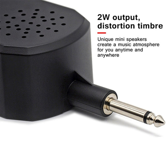 Mini guitar amplifier speaker with 1/4-inch audio plug extended from side