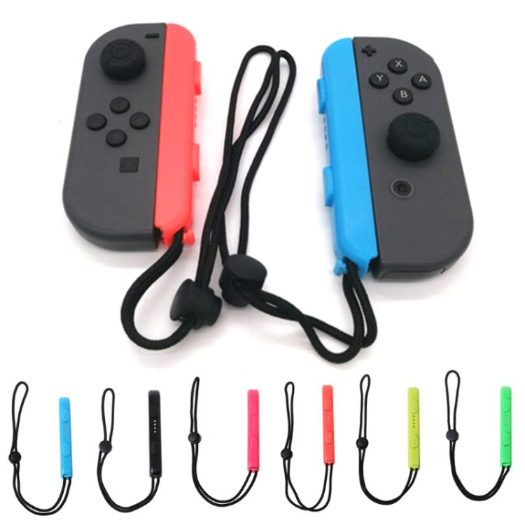 Joy-Con controllers with black wrist rope lanyards attached via cord and clips