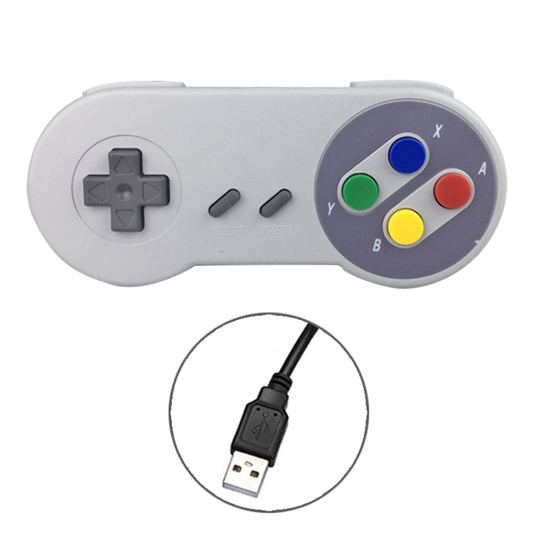 White wired game controller with colored face buttons and directional cross pad