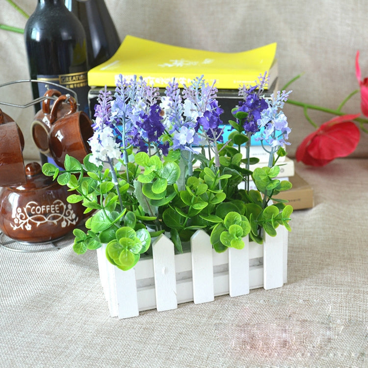 White wooden fence pot planter with purple and green faux blooms