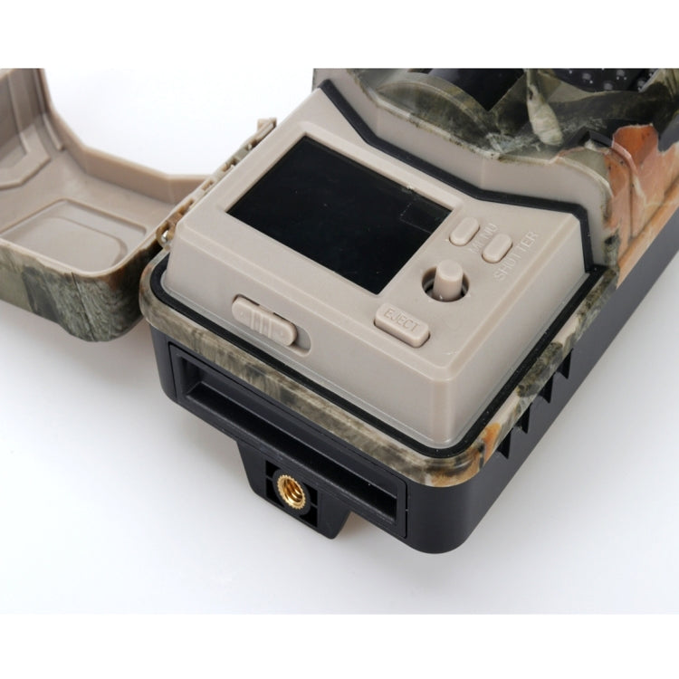 Camo trail camera close-up with front screen and control buttons
