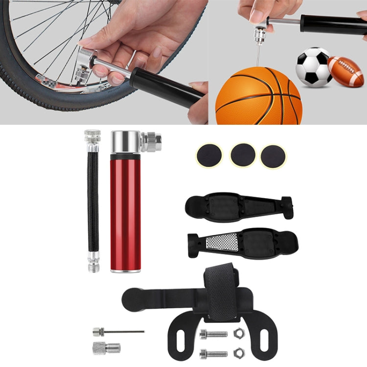 Bike pump set with red cylinder inflator, tire levers, patch pads, and small parts