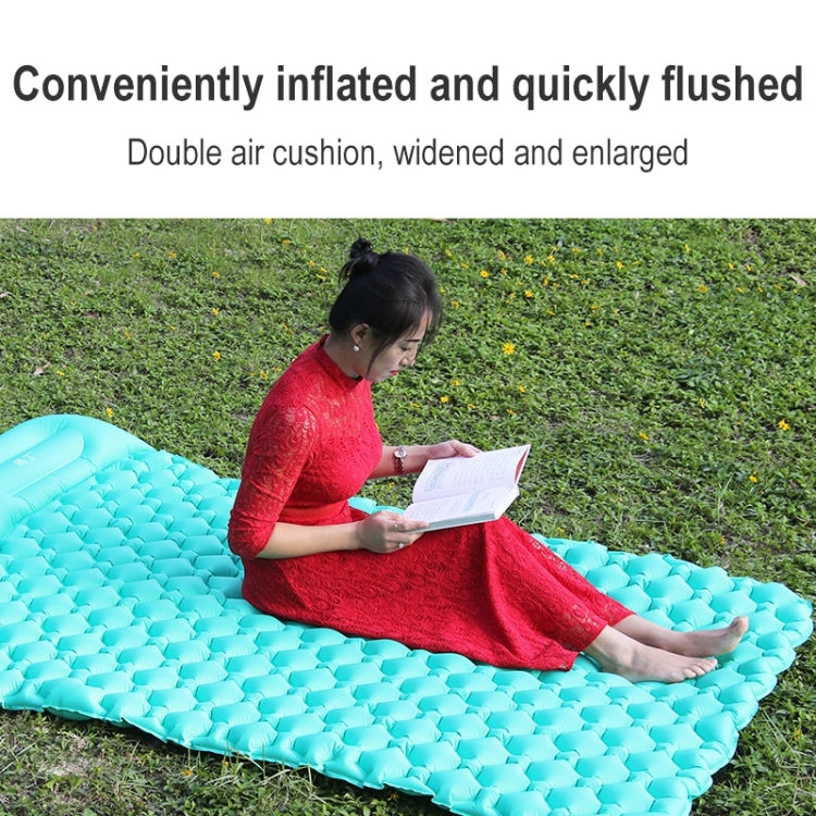 Teal inflatable camping double air bed with raised channels, shown on grass