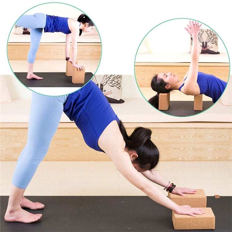 Tan cork yoga blocks under hands during pose, rectangular bricks with textured surface