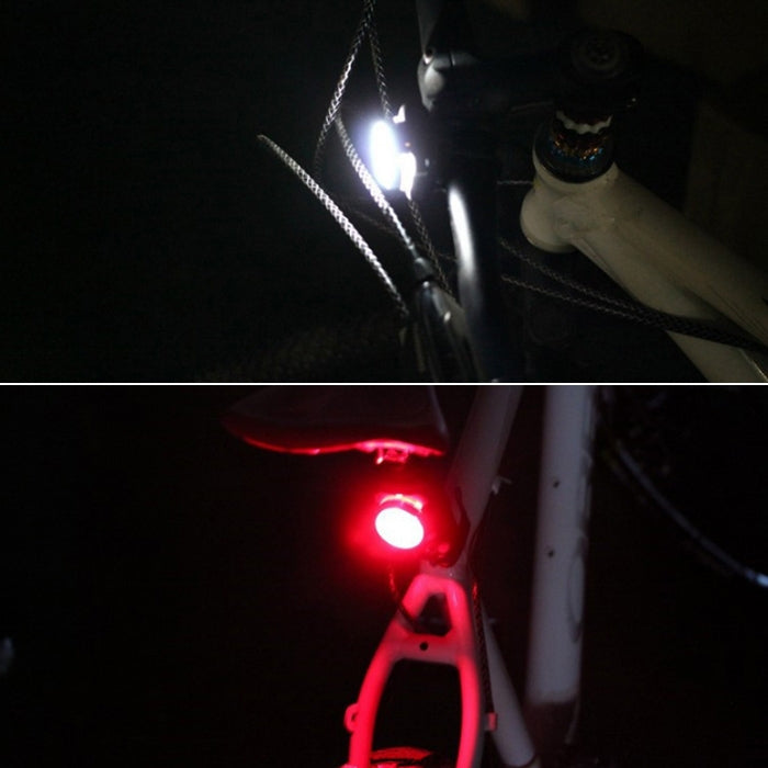 Bicycle rear red LED light glowing on a black mounting bracket