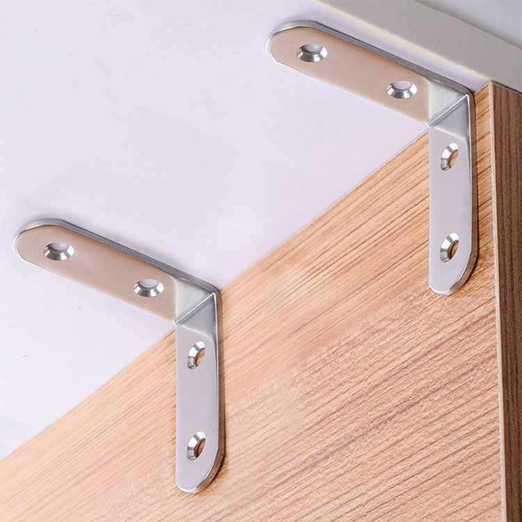 Stainless steel corner brace brackets securing wood panels, with screw holes