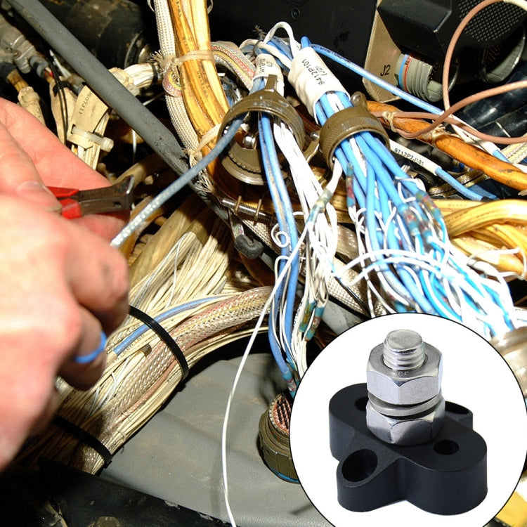 M10 terminal stud in a wiring setup, shown with black insulator base and hex nut