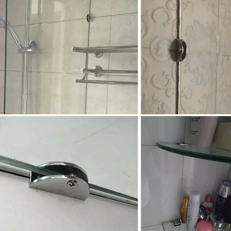 Metal glass clamp brackets securing glass shelves on a wall
