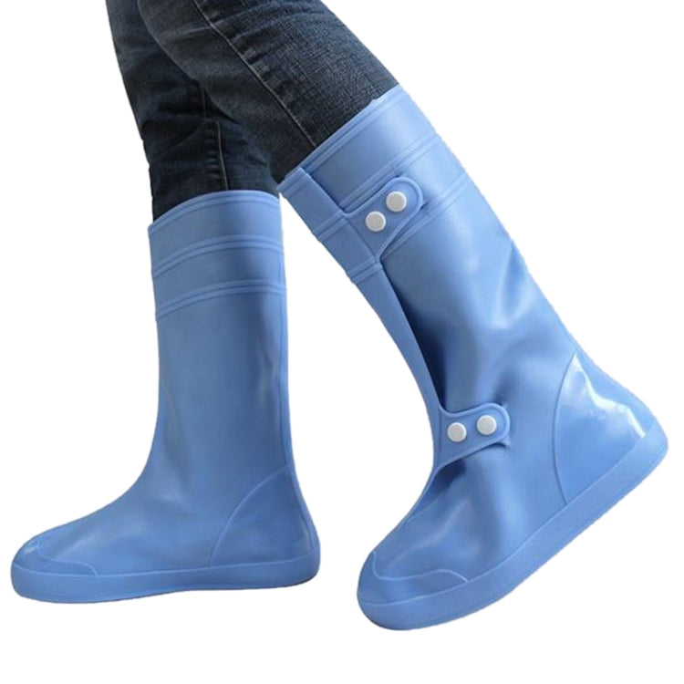 Light blue high tube adult shoe covers with snap button straps and flat soles