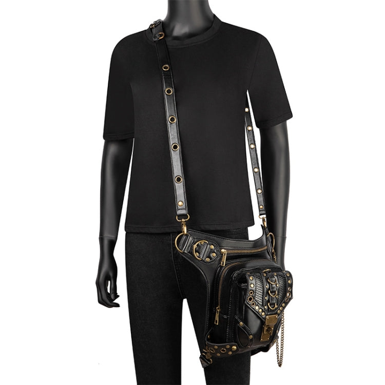 Black studded cross-body bag on model with long strap, front flap pocket, and chain