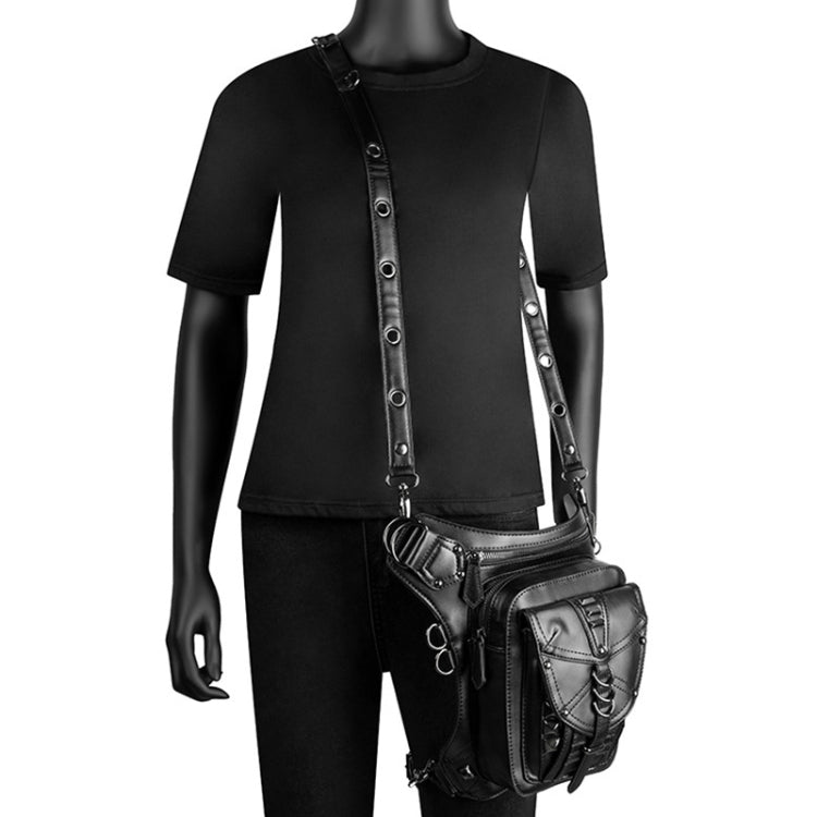 Black side-worn cross-body bag on model with adjustable strap and small front pocket