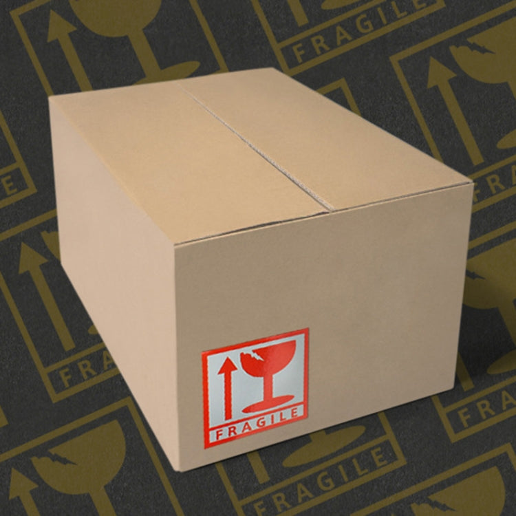 Red-and-white 'FRAGILE' sticker on a box front corner