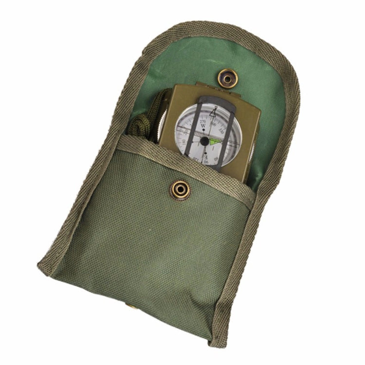 Army green fabric pouch holding a compact pocket compass with metal loop detail
