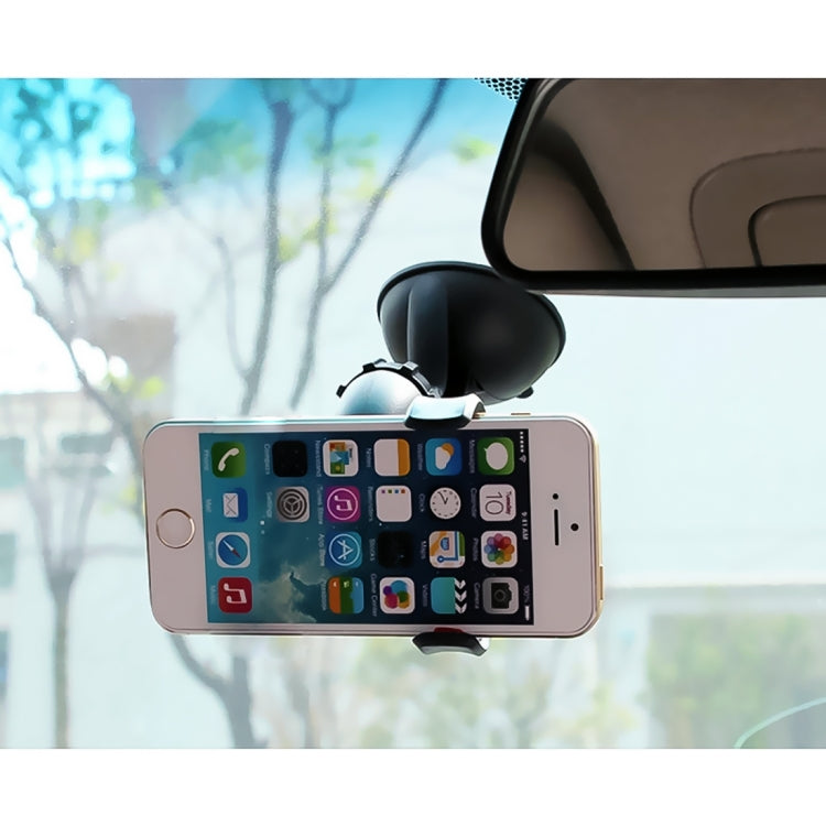 Mini tablet PC suction mount holding a smartphone, touchscreen home screen visible