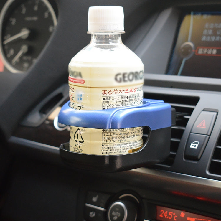 Car dashboard drink holder holding a clear plastic bottle