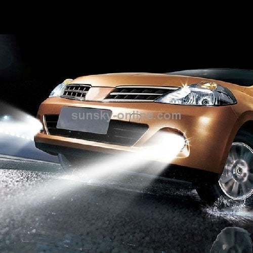 Car front headlight beam shining white light from xenon-style bulb