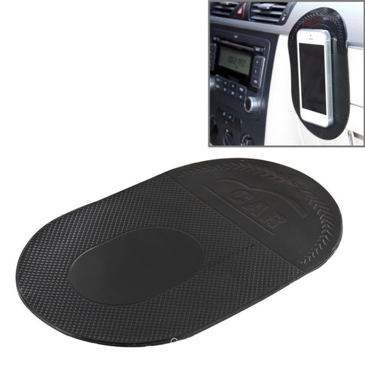 Black anti-slip sticky mat with oval center, textured grip surface.