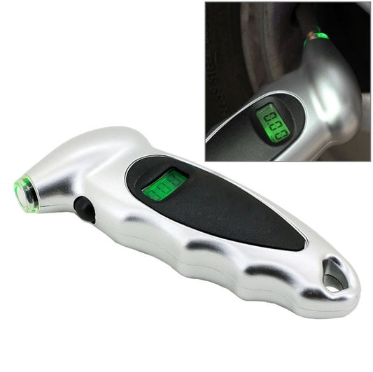 Silver digital tire gauge with green LCD display and black grip panel