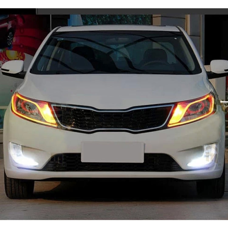 Front car DRL with glowing curved LED strips in amber on outer edges