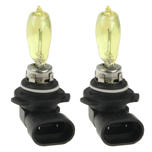 Two halogen bulbs with yellow glass bulbs and black H4-style base