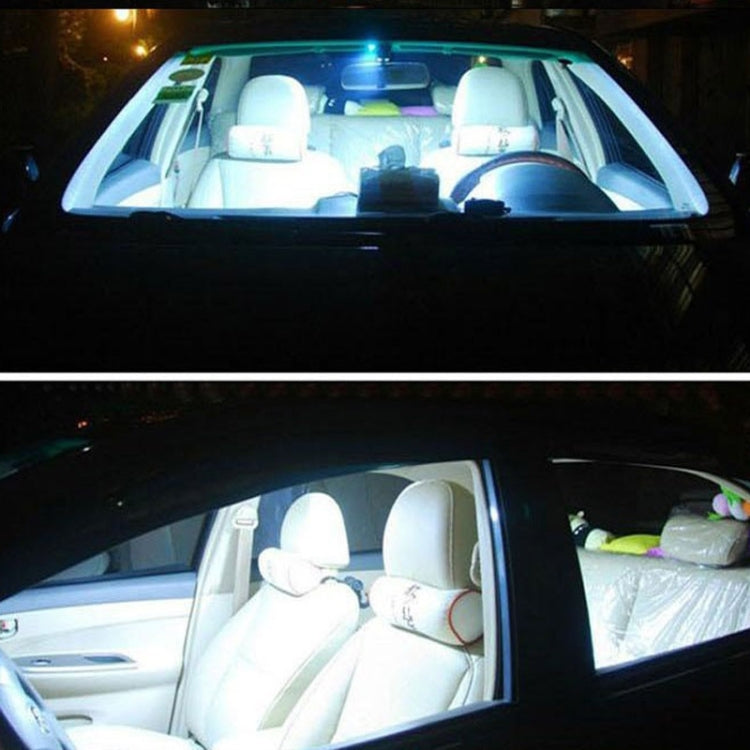 LED license plate bulbs lit, casting strong white light on the car interior