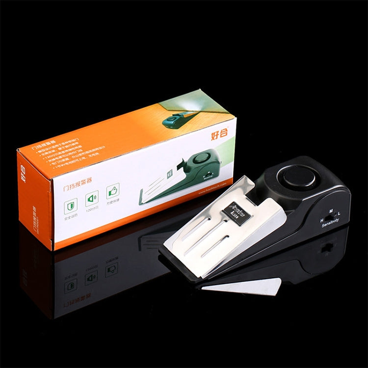 Black wedge door stop alarm with power switch and retail packaging