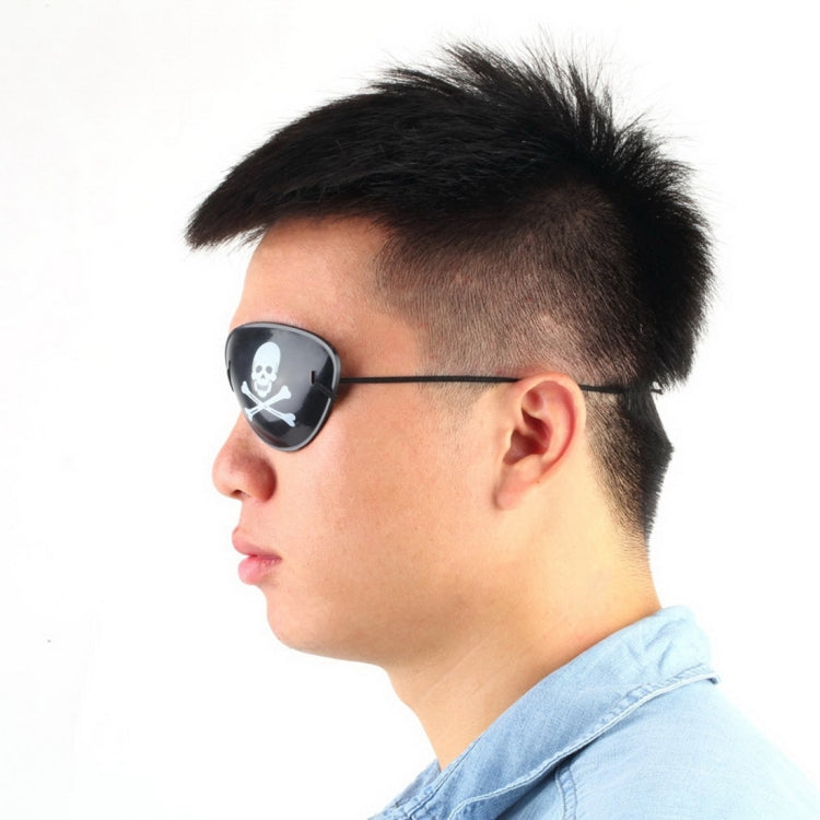 Pirate eye patch worn on face; black lens with white skull-and-crossbones print.