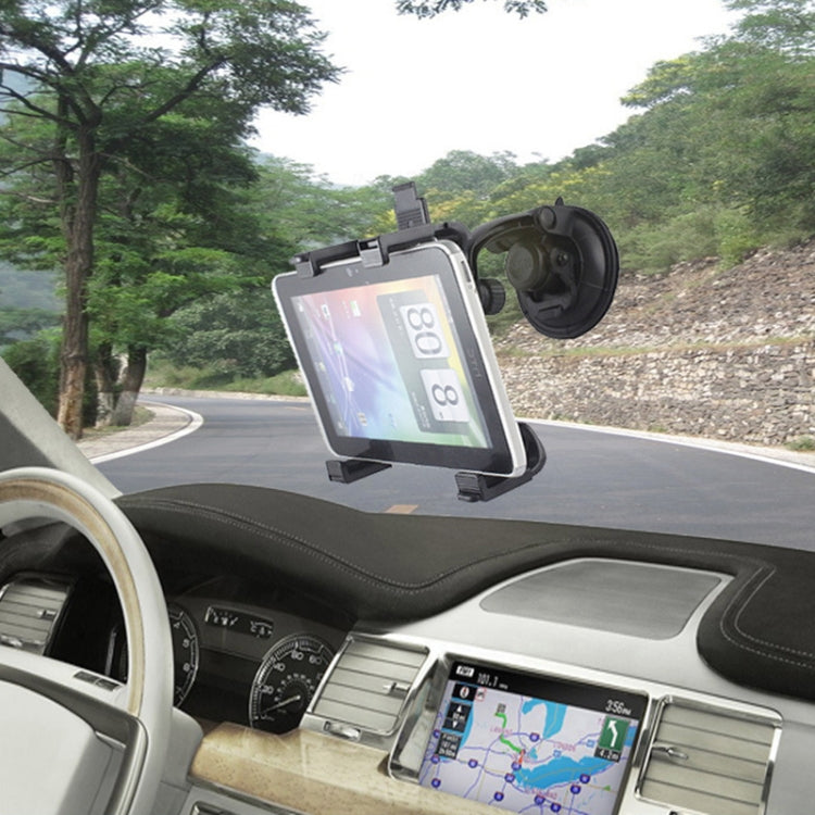 Car dashboard tablet holder with suction mount holding a tablet, dark gray