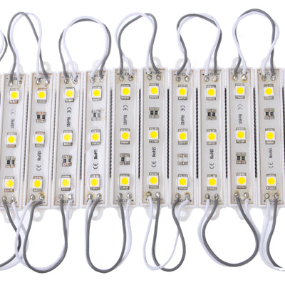 Warm white LED strip modules with attached gray wiring and rectangular circuit boards