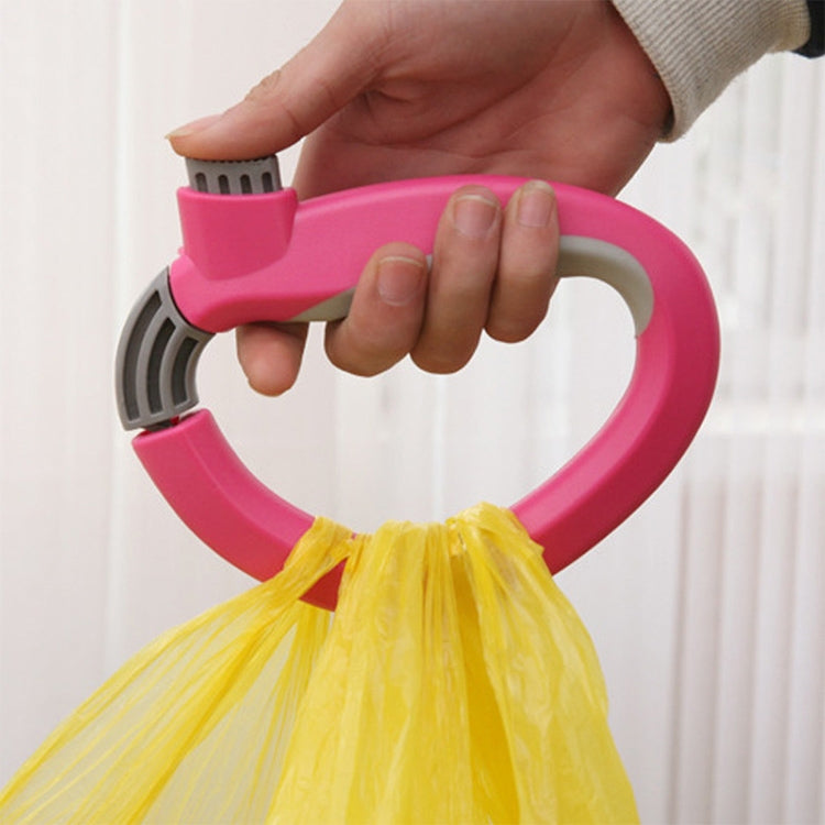 Hand gripping pink grocery bag carry handle with gray anti-slip tabs
