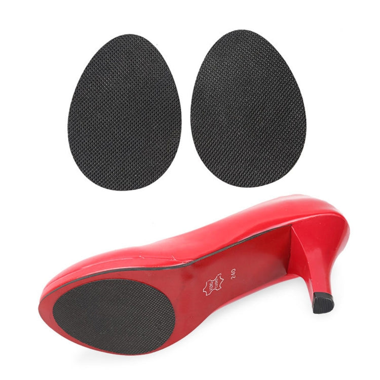 Black anti-slip sole protector pads shown on a red high-heeled shoe