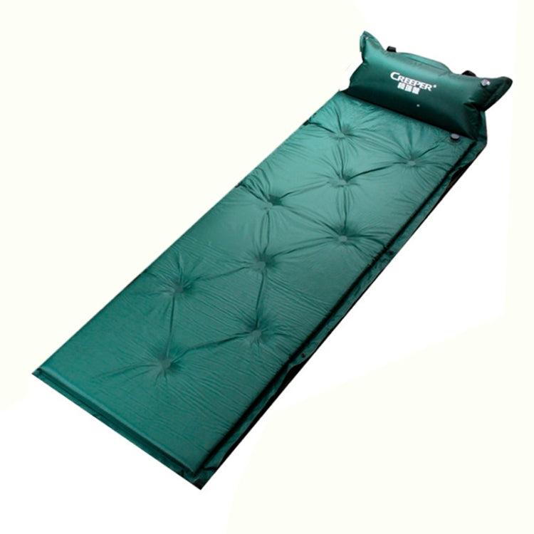 Green inflatable sleeping pad with built-in pillow, quilted baffles