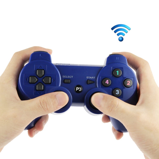 Blue wireless PS3 game controller held in hands, D-pad and face buttons visible