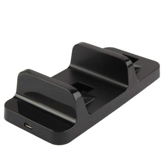 Black charging dock base with front USB port and two controller slots