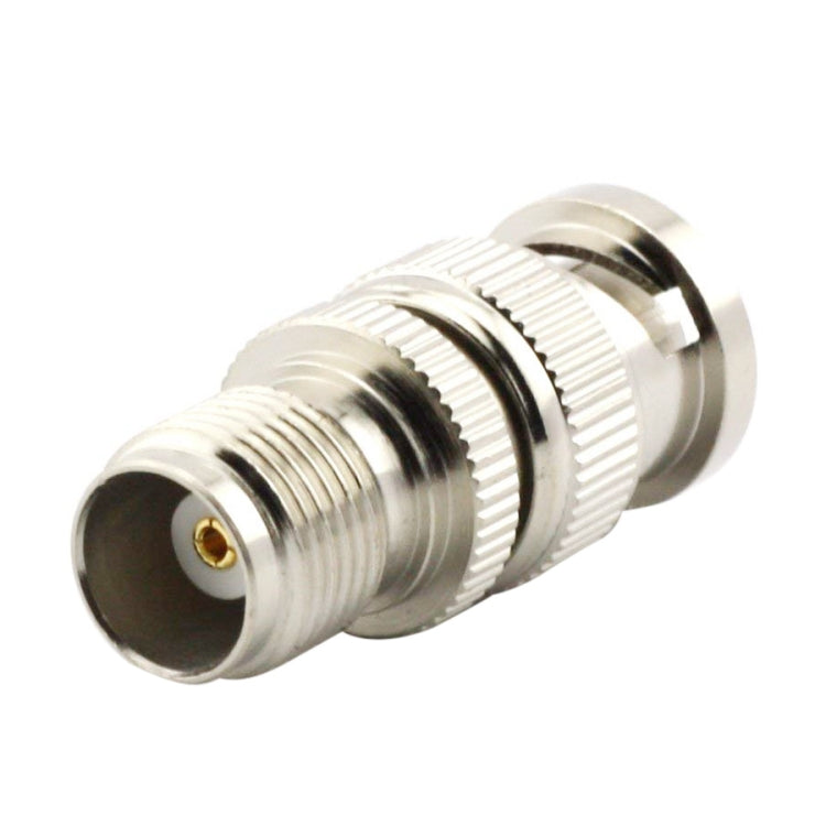 TNC-side view of BNC to TNC RF coaxial adapter with threaded metal coupling.
