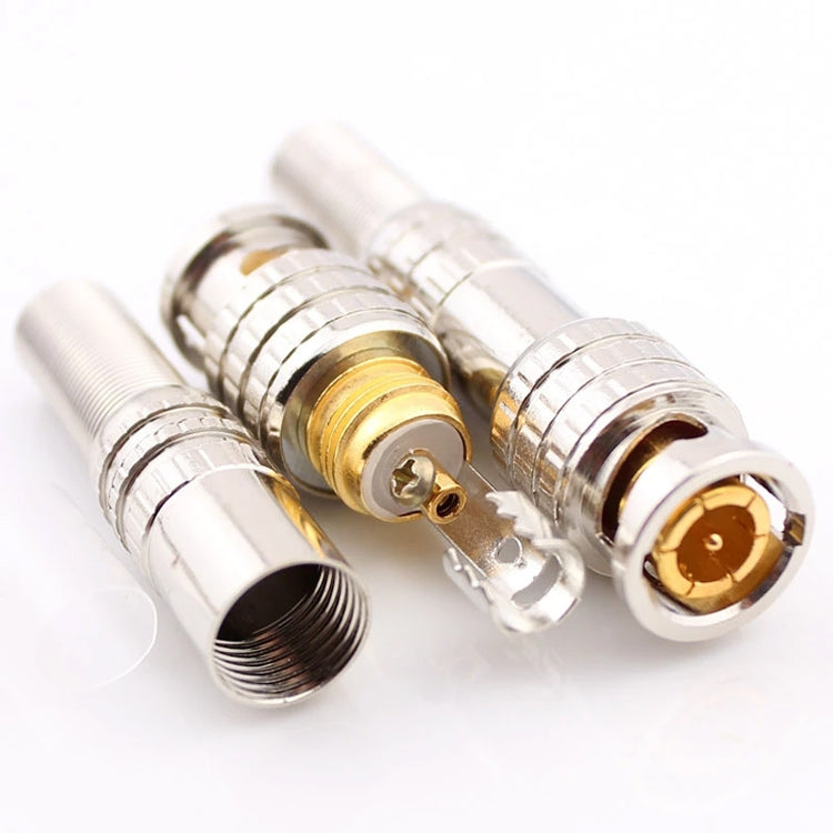 Close-up of BNC male-to-female connectors with gold center contacts and silver threaded ports