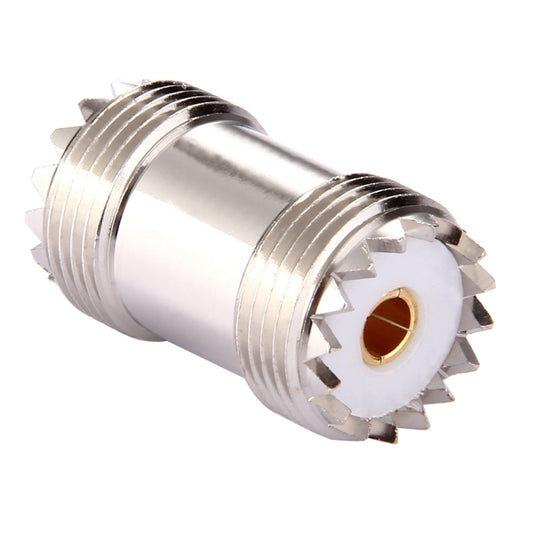 Silver UHF female-to-female RF connector, side view of two threaded female sockets