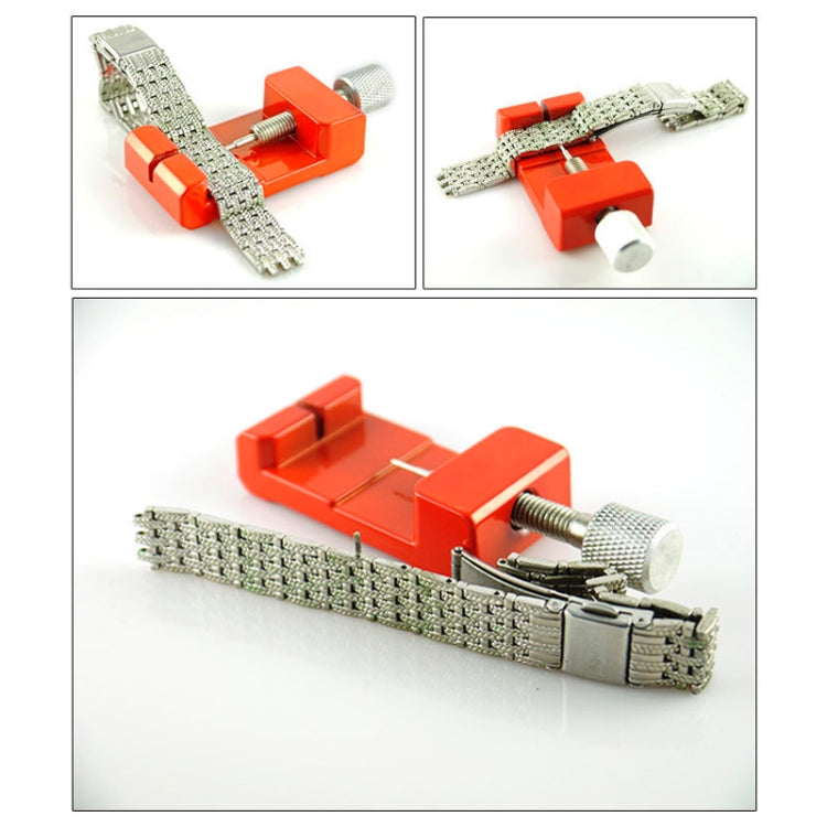 Red watch strap link pin remover tool shown with a metal watch strap band