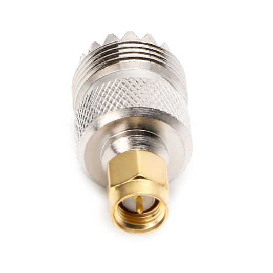 RF coaxial connector adapter with gold threaded insert and silver knurled outer body