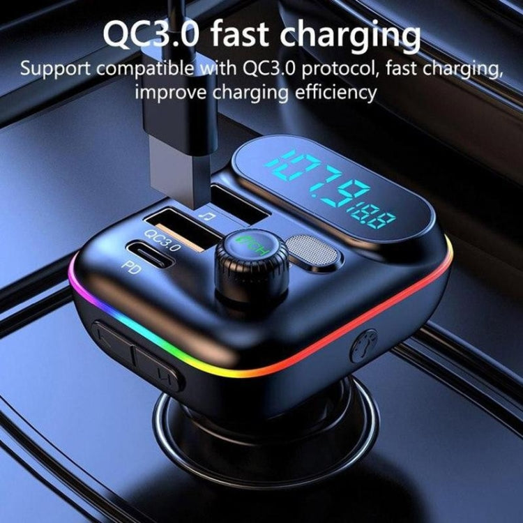 Black car FM MP3 transmitter with QC3.0 charging ports, rainbow trim, blue LCD and control knob