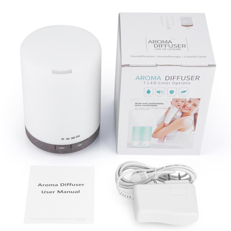 White essential oil diffuser with dark base, with power cable and manual