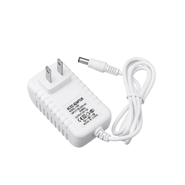 White AC to DC power adapter with flat US plug and coiled DC output cable