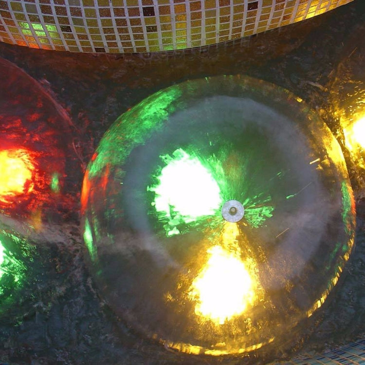 Illuminated hemisphere fountain nozzle spray dome with central outlet