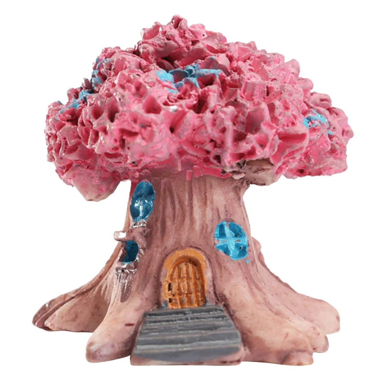 Pink resin tree decoration with tan trunk, orange arched door, gray steps and blue accents