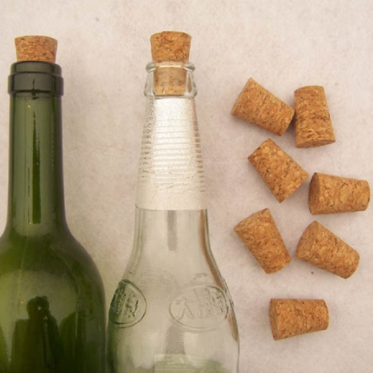Four cork bottle stoppers with green and clear bottles
