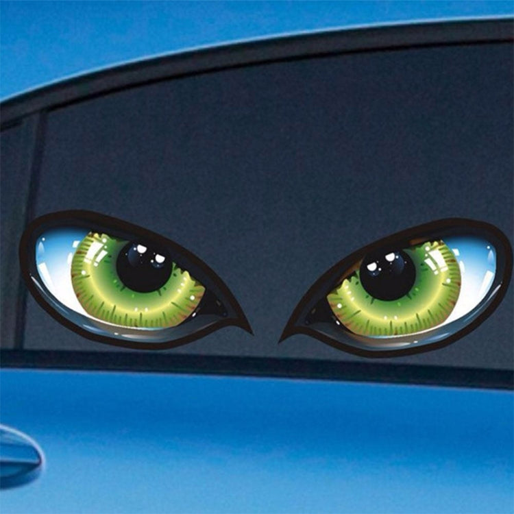 Pair of reflective cat-eye car stickers on car door, neon green eyes on black